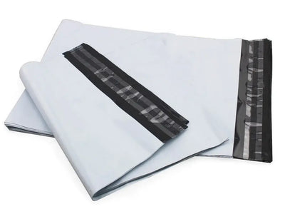White mailing envelopes with black sealing strips on a white background