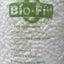 Close-up of a white expanded polystyrene peanuts bag with the text 'Bio-Fill' and environmental attributes such as 100% Biodegradable, Environmentally Friendly, Compostable & Water Soluble, Static Free, Lightweight, Resilient & Reusable.