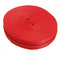 A roll of red polyester webbing strapping.