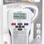 Brother PiTouch 1010 Electronic Labeleller in a white rubber grip design, shown in its original retail blister packaging with a clear plastic cover.