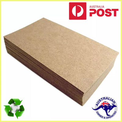A stack of brown kraft cardboard sheets with the Australian Post logo and a recycling symbol in the corner.