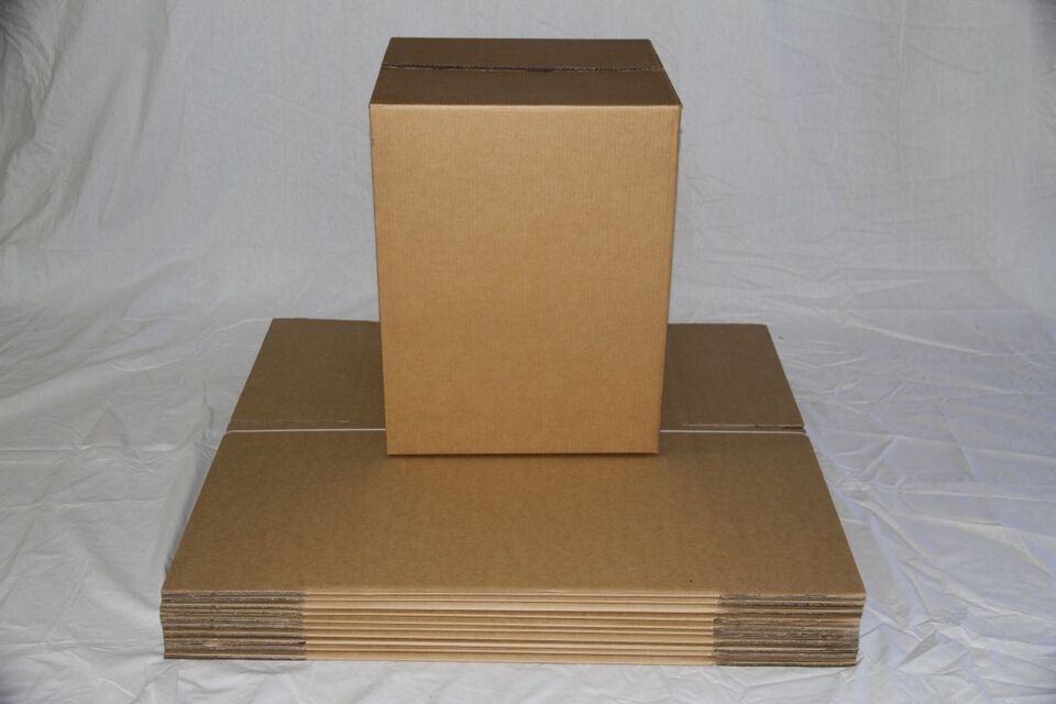 Cardboard packing boxes with fragile tape