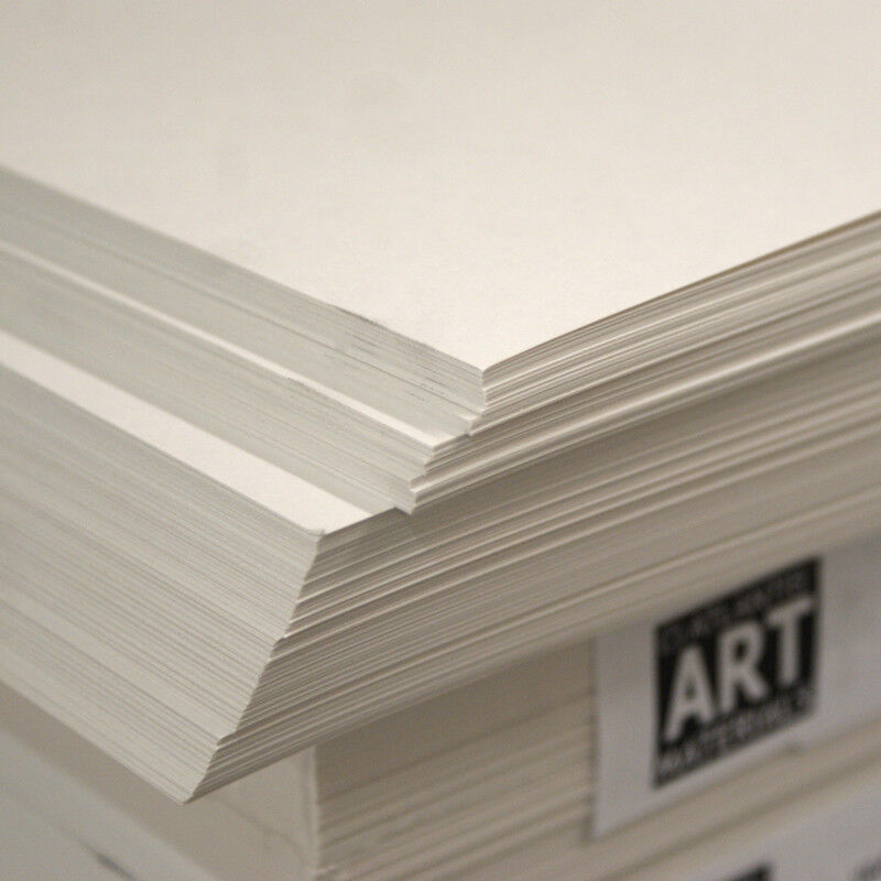 A stack of white cartridge drawing paper sheets, with the top sheet slightly lifted to show the texture. The paper is acid-free, indicated by the 'Arts & Crafts' branding at the bottom.
