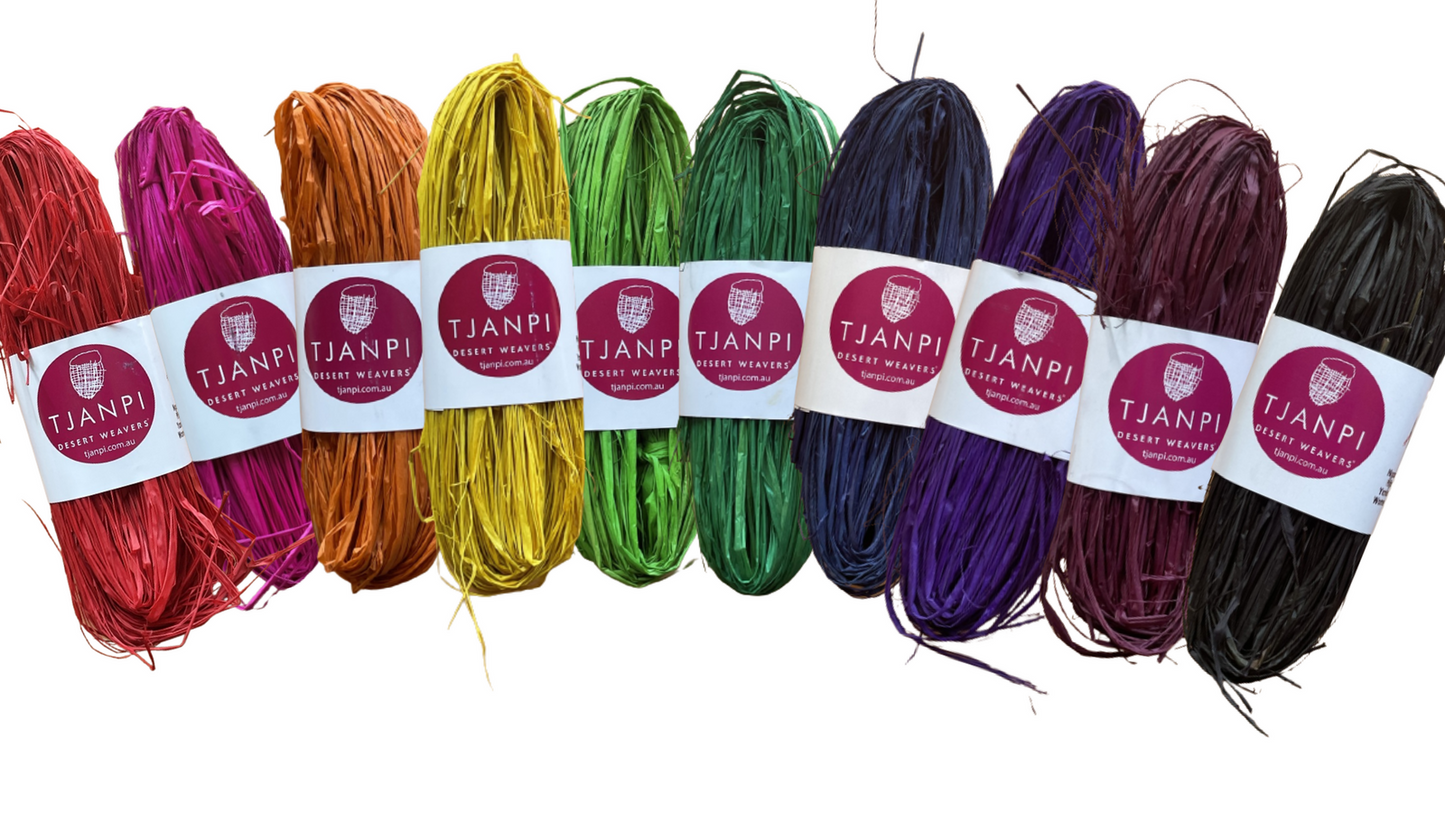 A collection of raffia strings in various colors bundled together, labeled with the brand name.