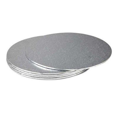 Stack of round silver foil cake boards in varying sizes.