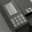 Close-up of a dark gray industrial water dispenser control panel with a digital display screen and numeric keypad, plus a yellow warning sticker on the side.