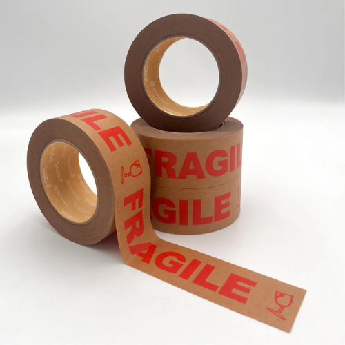 Three rolls of brown cardboard shipping tape printed with red 'FRAGILE' text and a glass icon, arranged on a light gray studio background.