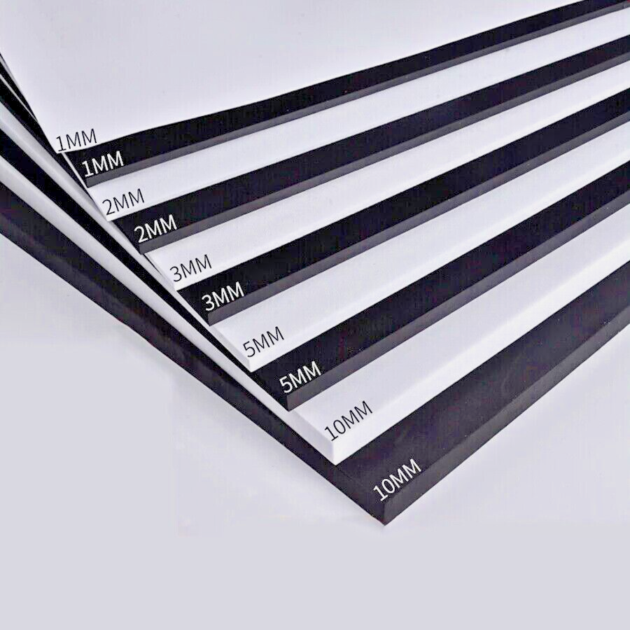 A stack of white foamboard backing boards with black polystyrene core, labeled with their thicknesses.