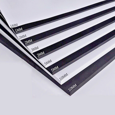 A stack of white foamboard backing boards with black polystyrene core, labeled with their thicknesses.