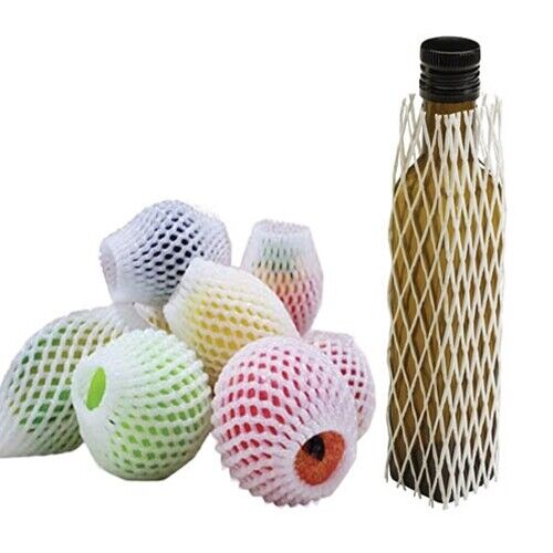 Reusable mesh bags for fruits and a bottle on a white background