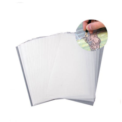A stack of transparent tracing paper sheets, with a inset image showing a hand using the paper for sketching.