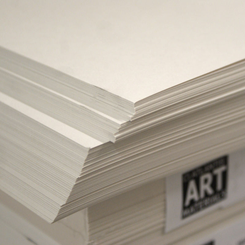 A stack of white, acid-free cartridge paper with a label that says 'ART & CRAFT PAPER'.