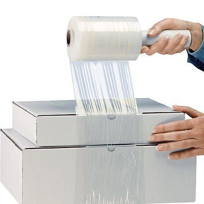 A roll of clear stretch wrap being applied to a box by a person.